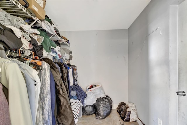 spacious closet featuring tile patterned flooring