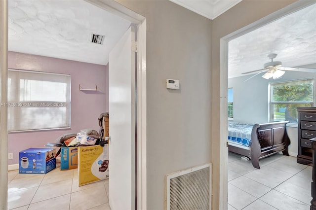 bathroom with ceiling fan, tile patterned floors, and a textured ceiling