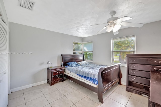 bedroom featuring ceiling fan and light tile patterned floors