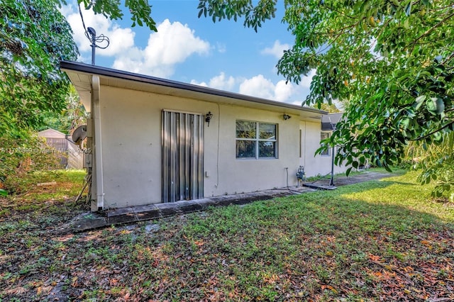 back of house with a yard