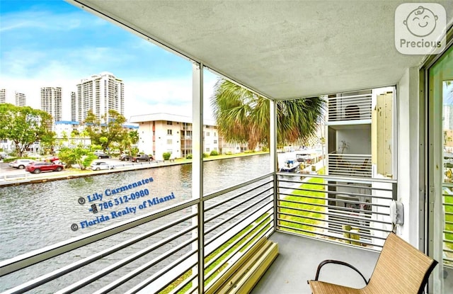 balcony featuring a water view