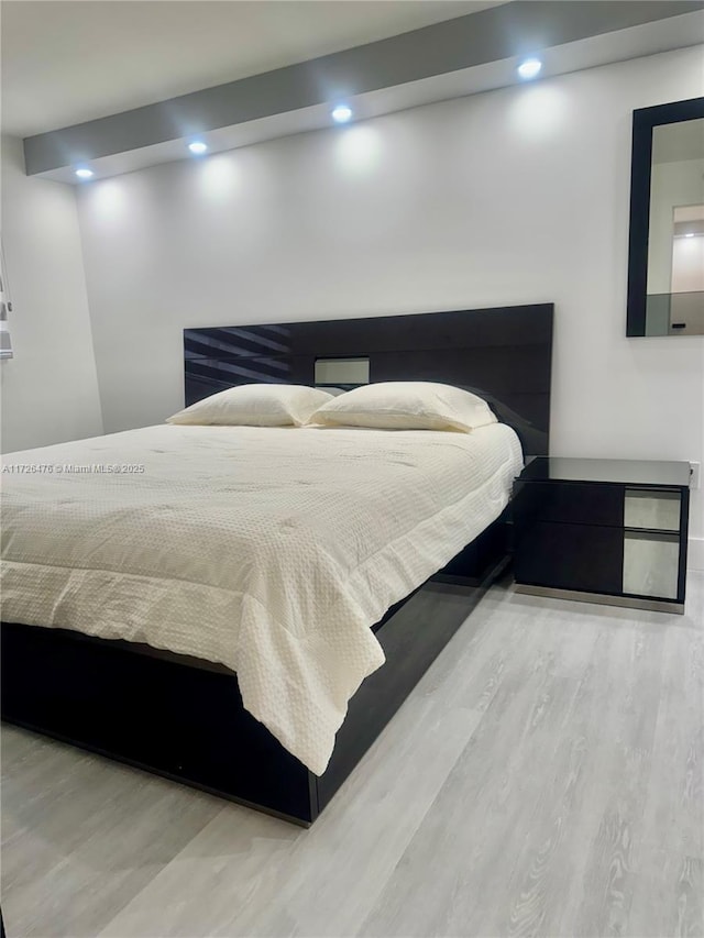 3725 NE 169th St Unit B-203, North Miami Beach, FL 33160 - bedroom featuring wood finished floors and recessed lighting
