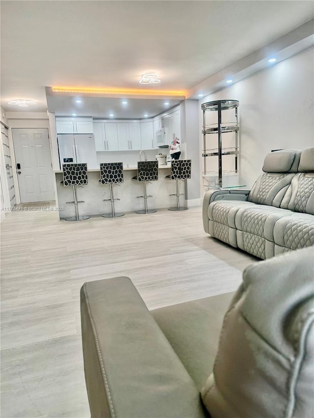 living room featuring light wood-type flooring