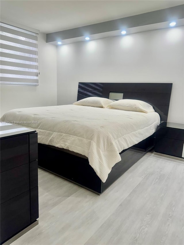 bedroom featuring light hardwood / wood-style flooring