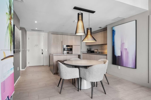 dining space featuring sink