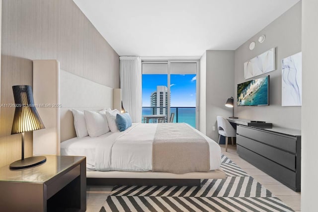 bedroom featuring access to exterior and floor to ceiling windows