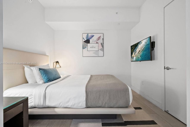 bedroom featuring wood-type flooring