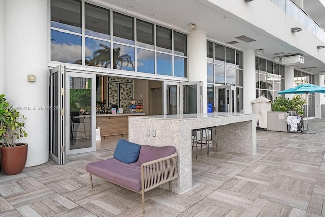 view of patio featuring an outdoor bar