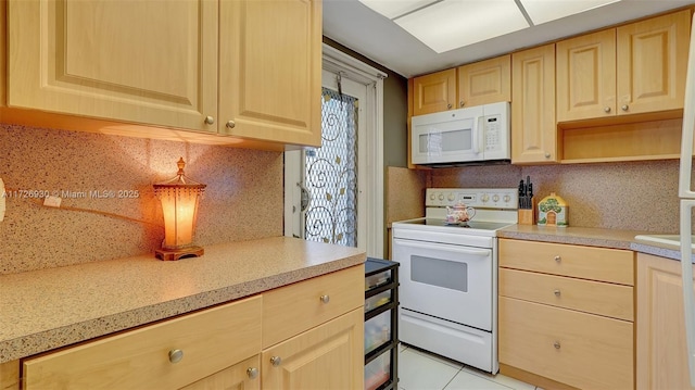 kitchen featuring light tile patterned floors, decorative backsplash, light brown cabinets, and white appliances