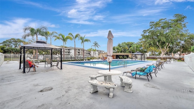 view of swimming pool featuring a gazebo and a patio