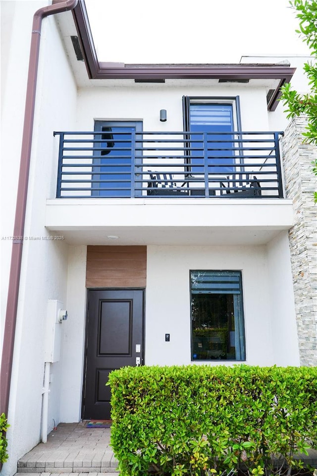 doorway to property featuring a balcony