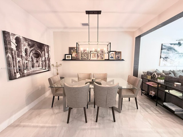 dining area featuring a chandelier