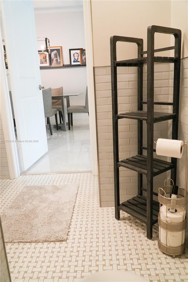 hallway with tile patterned floors