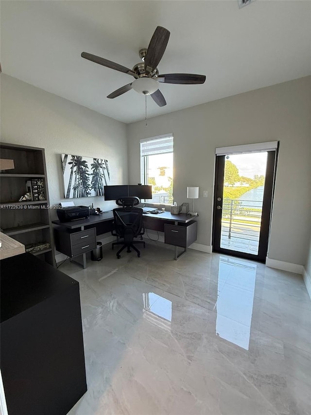 office area with ceiling fan and a wealth of natural light