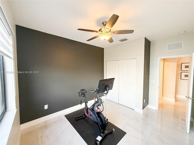 workout area with ceiling fan