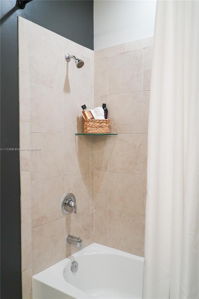 bathroom with shower / bathtub combination with curtain