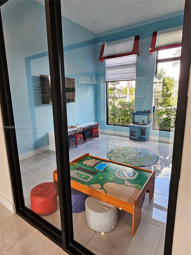 recreation room featuring tile patterned floors