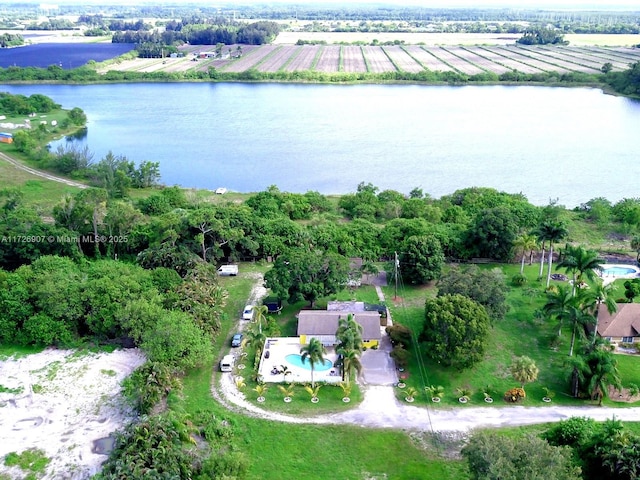 drone / aerial view featuring a water view and a rural view