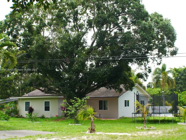 view of yard with a trampoline