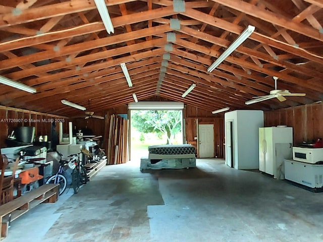 garage featuring ceiling fan and white fridge