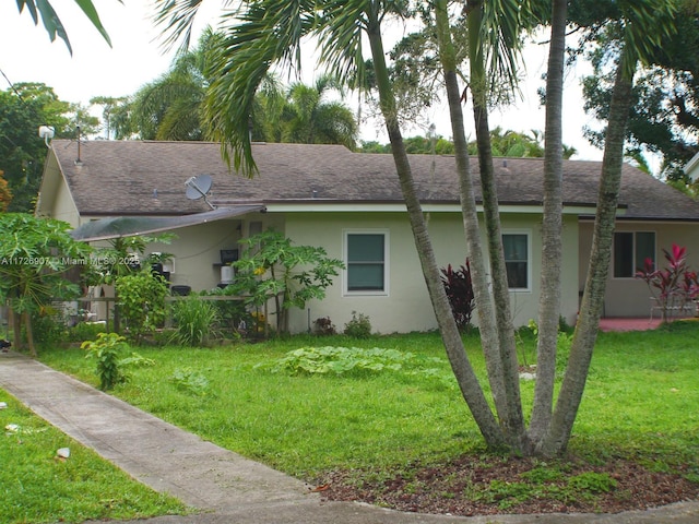 view of home's exterior featuring a lawn