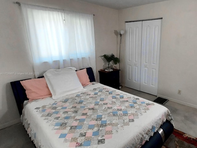 carpeted bedroom with a closet