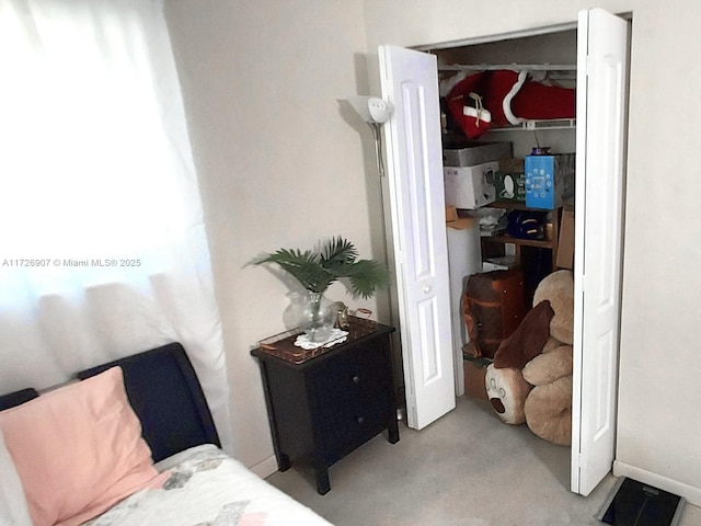 carpeted bedroom featuring a closet