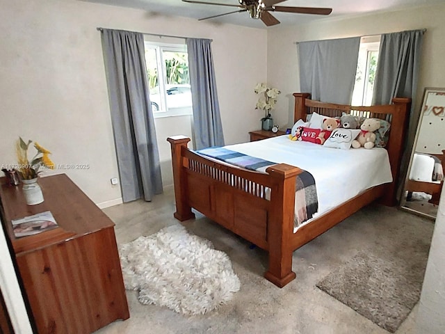 bedroom featuring ceiling fan and concrete floors