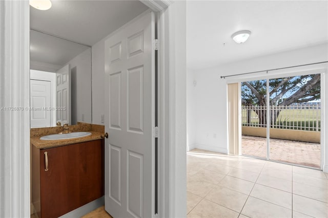 bathroom with tile patterned floors and vanity