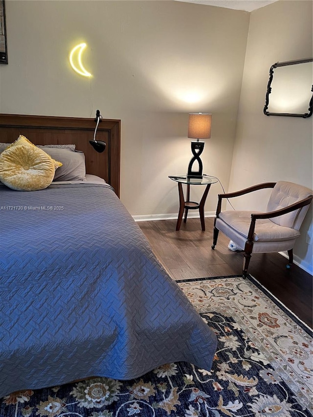 bedroom with wood-type flooring