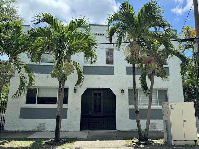 view of building exterior featuring a fenced front yard