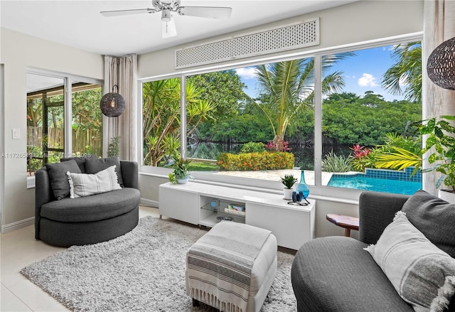 sunroom with ceiling fan