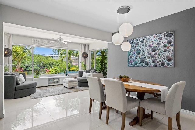 tiled dining area featuring ceiling fan