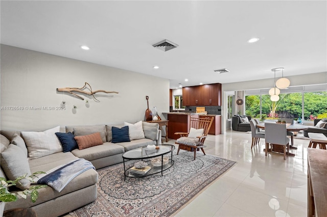 living room with light tile patterned flooring