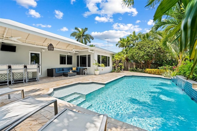 view of pool with an outdoor hangout area, ceiling fan, pool water feature, and a patio