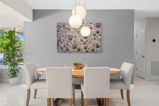 425 NE 29th St, Wilton Manors, FL 33334 - tiled dining area featuring baseboards