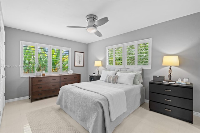 425 NE 29th St, Wilton Manors, FL 33334 - bedroom featuring baseboards, ceiling fan, and light tile patterned floors
