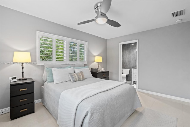 tiled bedroom with ceiling fan and ensuite bathroom