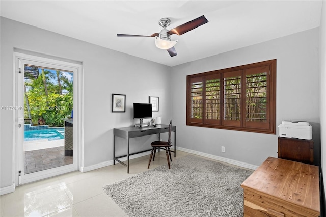 office with ceiling fan and light tile patterned floors