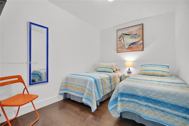 bedroom featuring dark wood-type flooring