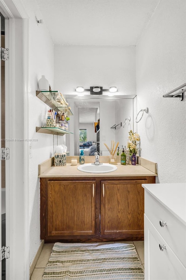 bathroom featuring vanity and tile patterned flooring