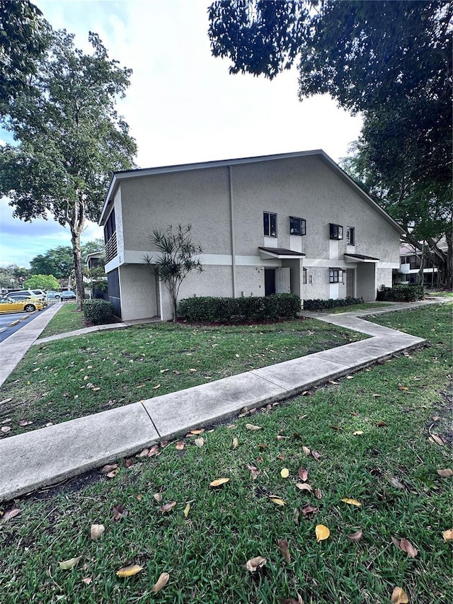 view of home's exterior featuring a lawn