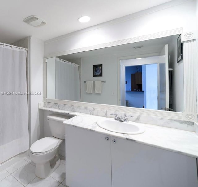 bathroom with toilet, vanity, and walk in shower