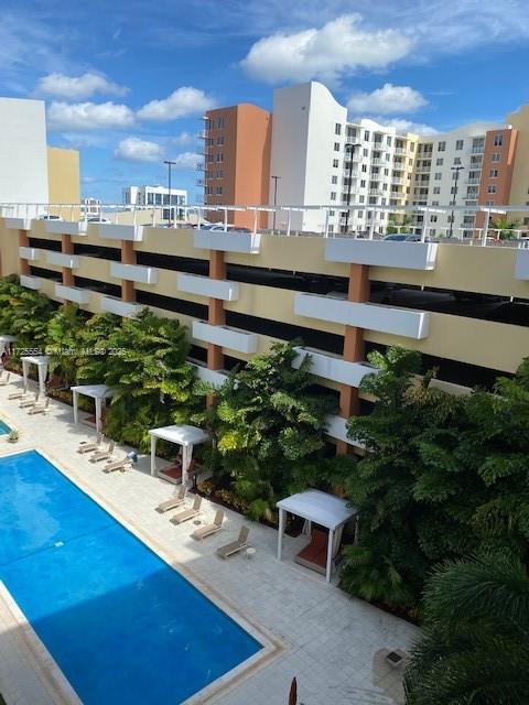 view of swimming pool featuring a patio area