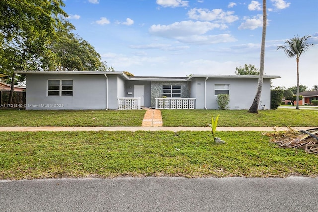 ranch-style house with a front lawn