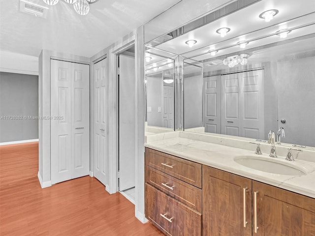 bathroom featuring vanity and hardwood / wood-style floors