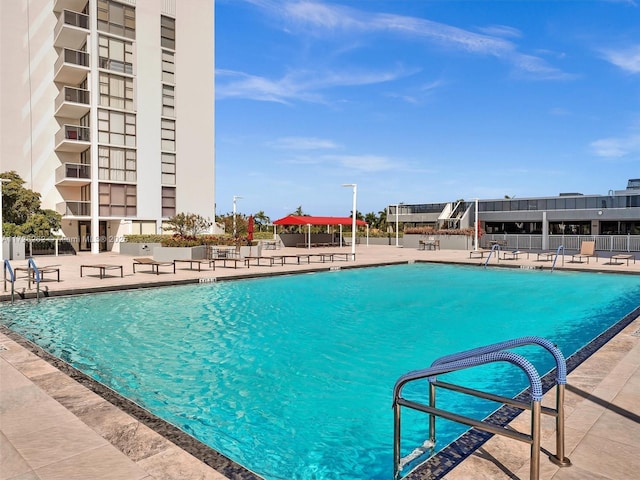 view of swimming pool with a patio