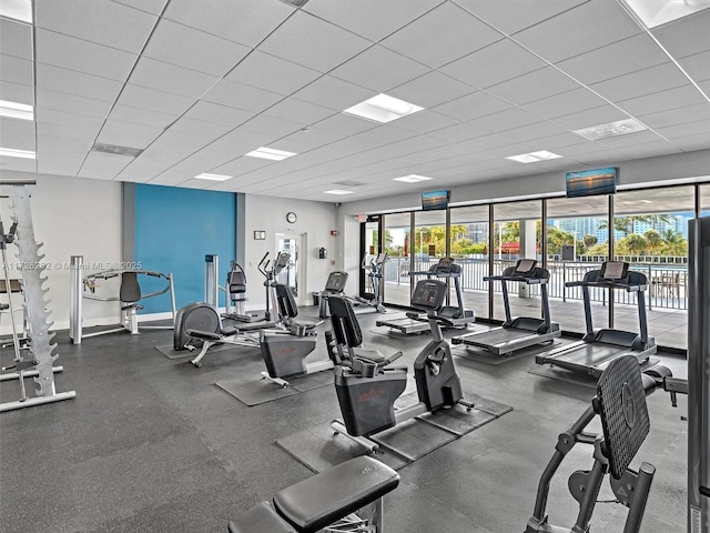 gym featuring a paneled ceiling