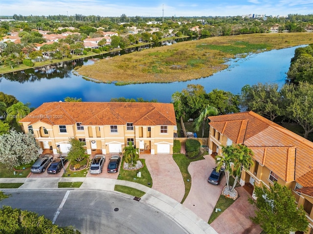 birds eye view of property featuring a water view