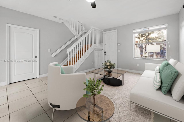 tiled living room featuring ceiling fan